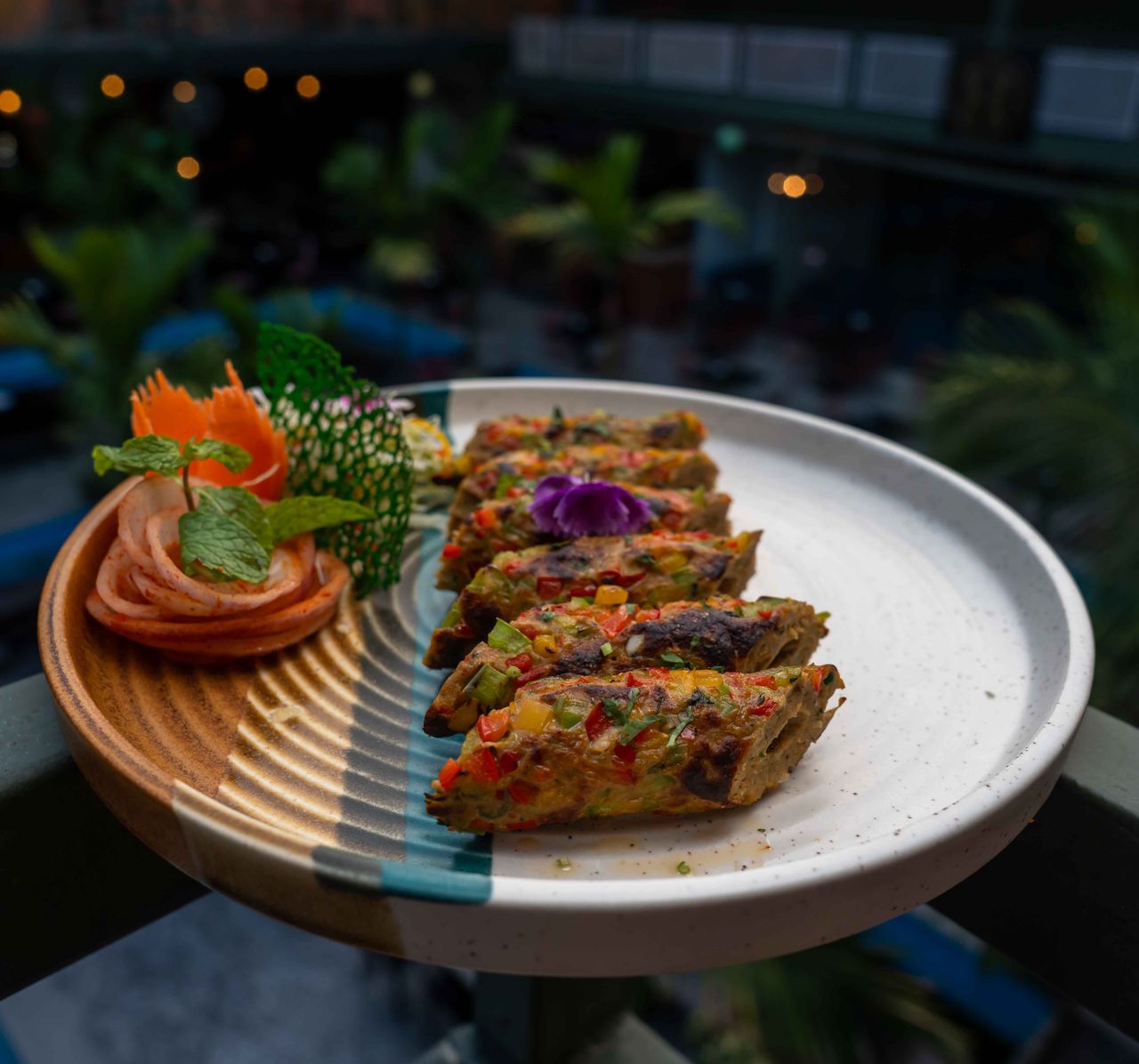about-us A beautifully plated dish of vegetable kebabs with artistic garnish, perfect for culinary presentations.